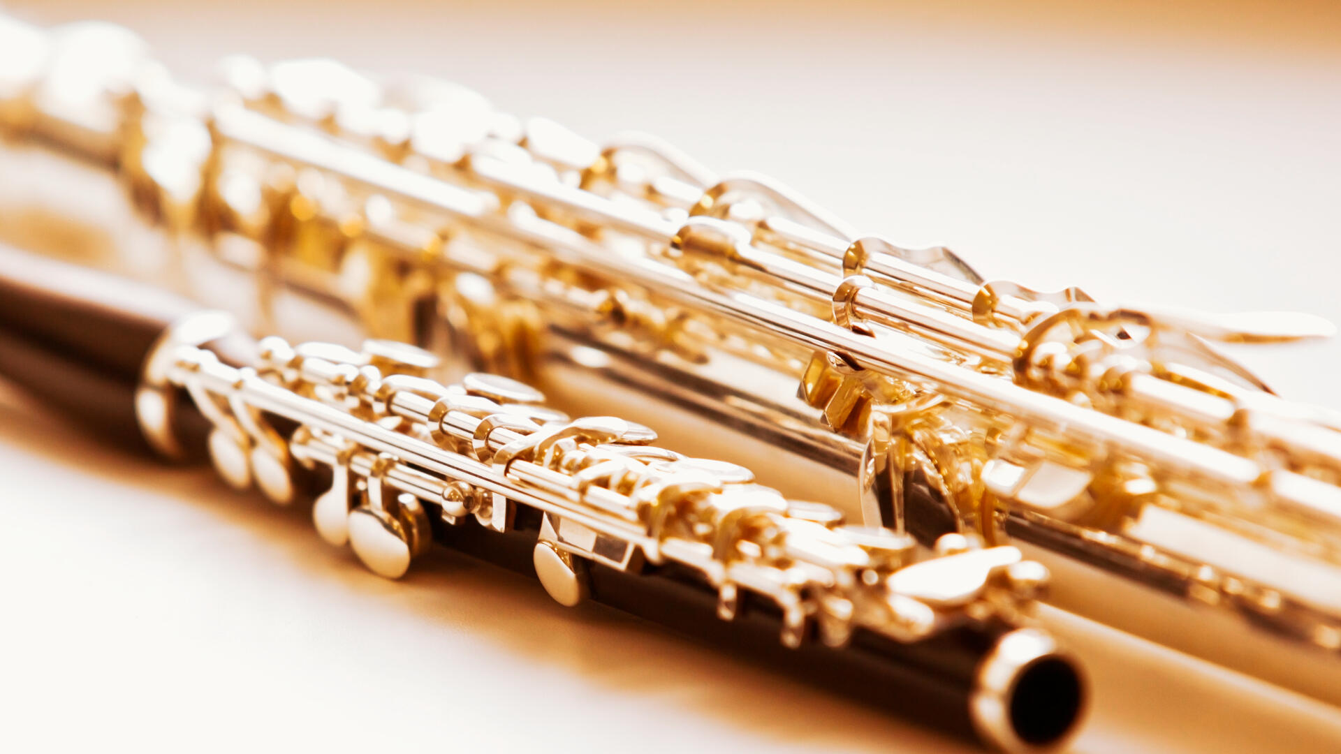 Flute and Piccolo Flute and piccolo laying side by side.